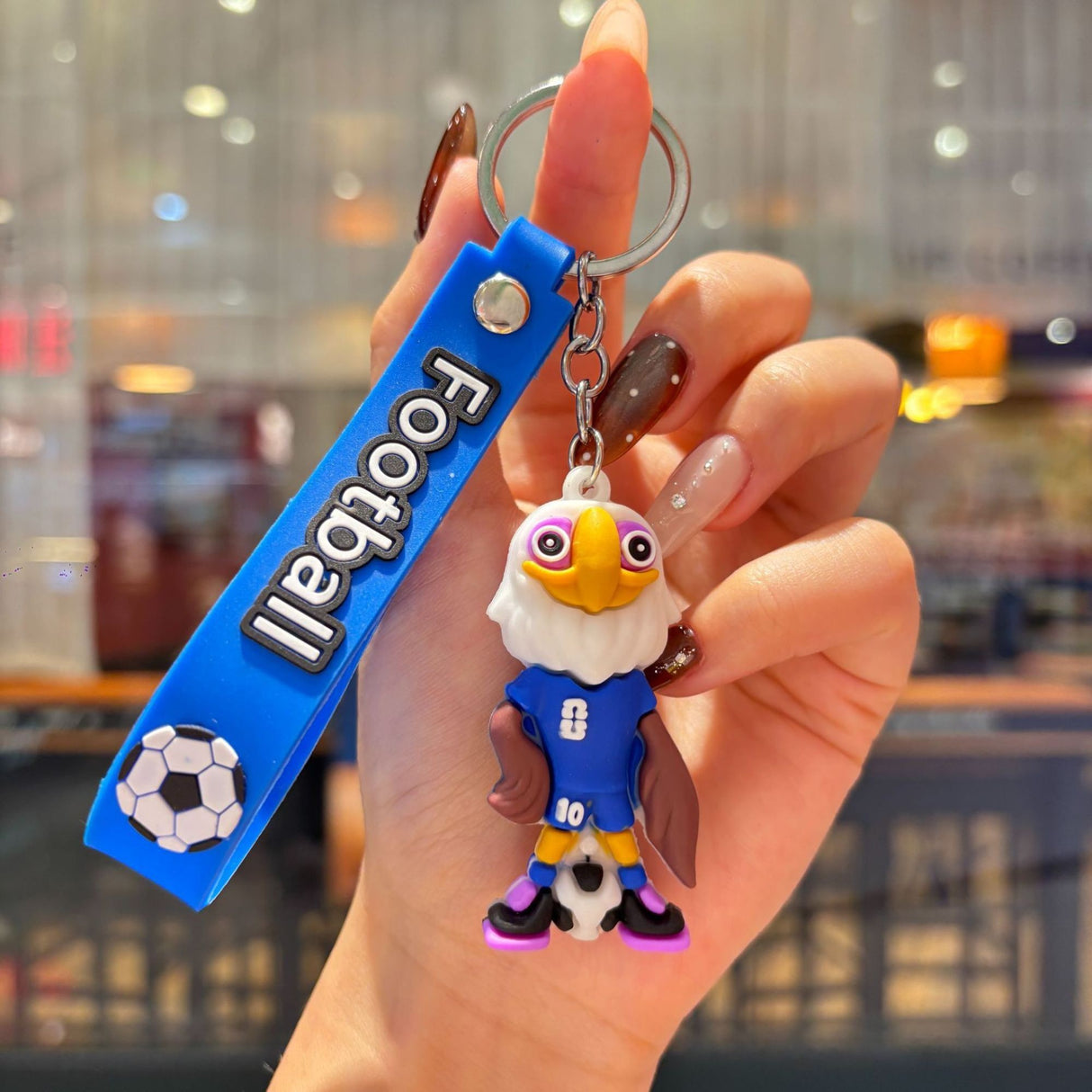 Breloc Flippy mascotă fotbal albastru atașat la rucsac, accesoriu sport Cupa Mondială