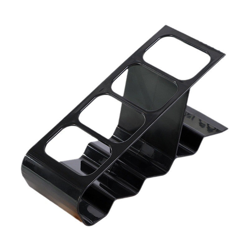 Organizator de birou din plastic negru cu 4 compartimente pentru telecomenzi și telefoane, vedere frontală