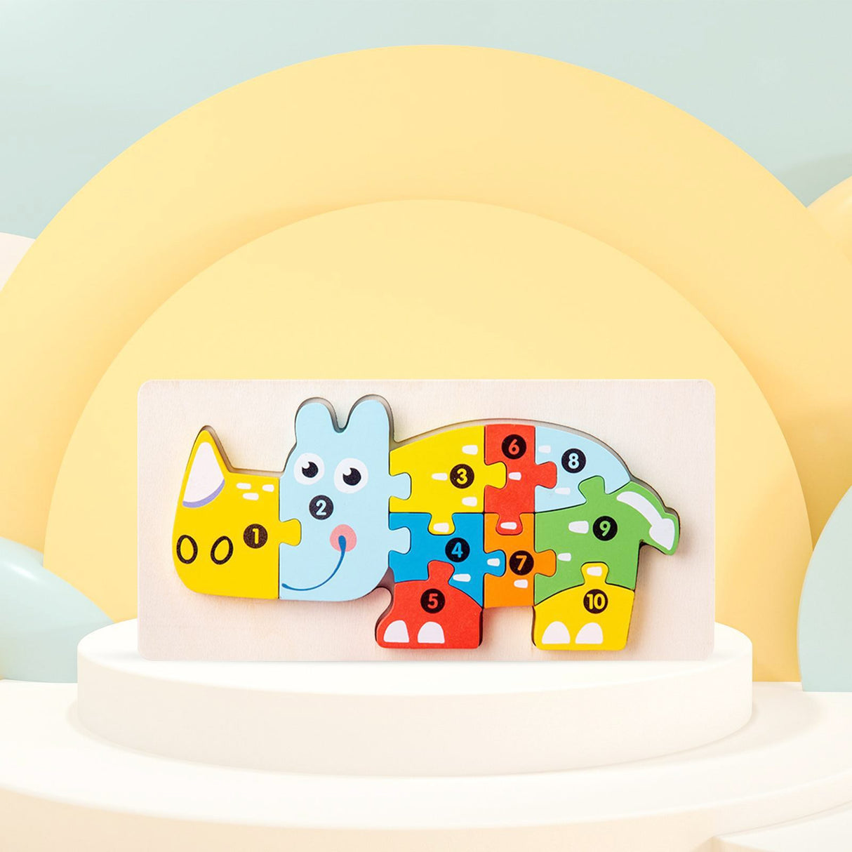 Puzzle lemn Flippy Rinocer dezasamblat, cele 11 piese colorate dispuse pe fond alb