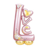 Balon din Folie Metalizata, Vivimall, Figurine, Model LOVE, Tematica Iubire, 110x64 cm, Ambalaj Individual, Pai Inclus, Umflare cu Aer sau Heliu, Roz Deschis - vivimall.ro
