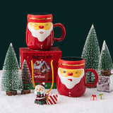 Cana Ceramica tematica Mos Craciun Vivimall, 430 ml, capac tip oglinda, ambalaj cadou inclus, fete random, 8 x 11.5, rosu - vivimall.ro