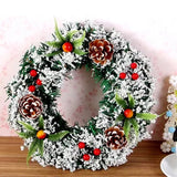 Karácsonyi koszorú, átmérője 20 cm, műfenyőből, tobozokkal és áfonyával díszítve, havas, /fehér