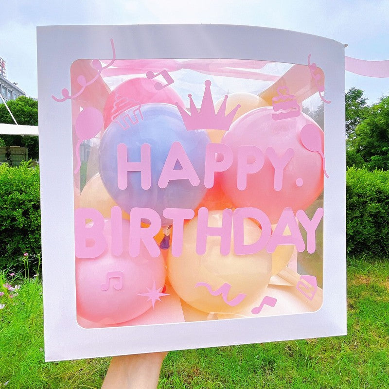 Cutie pentru Baloane, Vivimall, Tematica Aniversare, Model Scris Happy Birthday, Baloane Albastre, Roz, Galbene si Panglica Incluse, Contur Alb, Transparenta, 30x30 cm - vivimall.ro