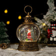 Felinar decorativ Crăciun vintage negru-auriu cu Moș Crăciun și efect zăpadă animat, vedere frontală