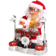 Decorațiune Moș Crăciun animat cu tobe, 17 cm, costum roșu festiv, vedere frontală