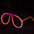 Ochelari roz fluorescenți din plastic pentru petrecere, vedere frontală, design rotund clasic