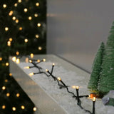 Instalatie Craciun liniara, cu transformator 31V, 10m, alb cald, 100 LED-uri V5, 8 jocuri de lumini, Fir verde, Vivimall - vivimall.ro