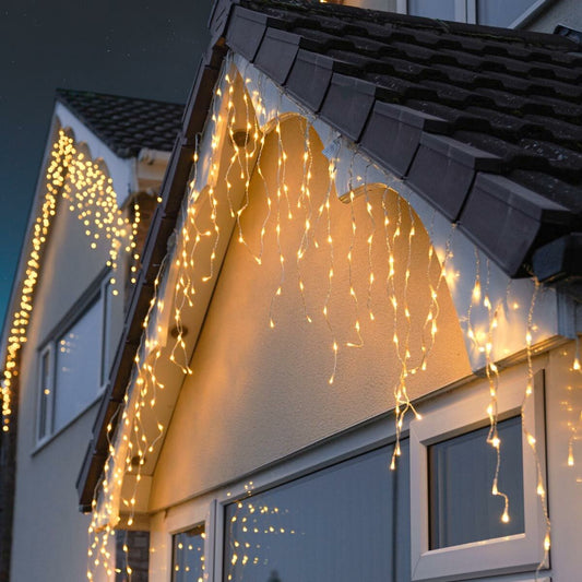 Instalatie Craciun Yoto, Tip Franjuri/Turturi, 12 m, 300 LED-uri, Prelungitor 1.5 m, 8 Jocuri de Lumini, Interconectabila, Conectare la Retea, Fir transparent, Interior/Exterior, Alb Cald - vivimall.ro