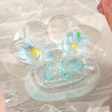 Jucarie Antistres Squishy, Flippy, Labuta de Pisica Pufoasa, cu Revenire Lenta, 7 x 6.5 cm, Model Flori 2, Transparent - vivimall.ro