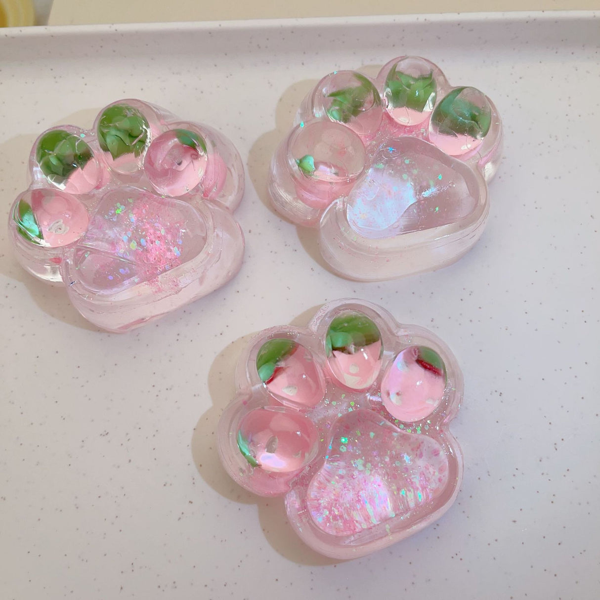 Jucarie Antistres Squishy, Vivimall, cu Revenire Lenta, Squeeze Pinch Family, Model Labuta de Pisica cu Sclipici, 6.5x6 cm, 60g, Ambalaj Transparent, Roz - vivimall.ro