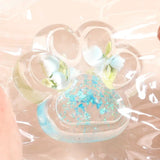 Jucarie Antistres Squishy, Flippy, Labuta de Pisica Pufoasa, cu Revenire Lenta, 7 x 6.5 cm, Model Flori 1, Transparent - vivimall.ro