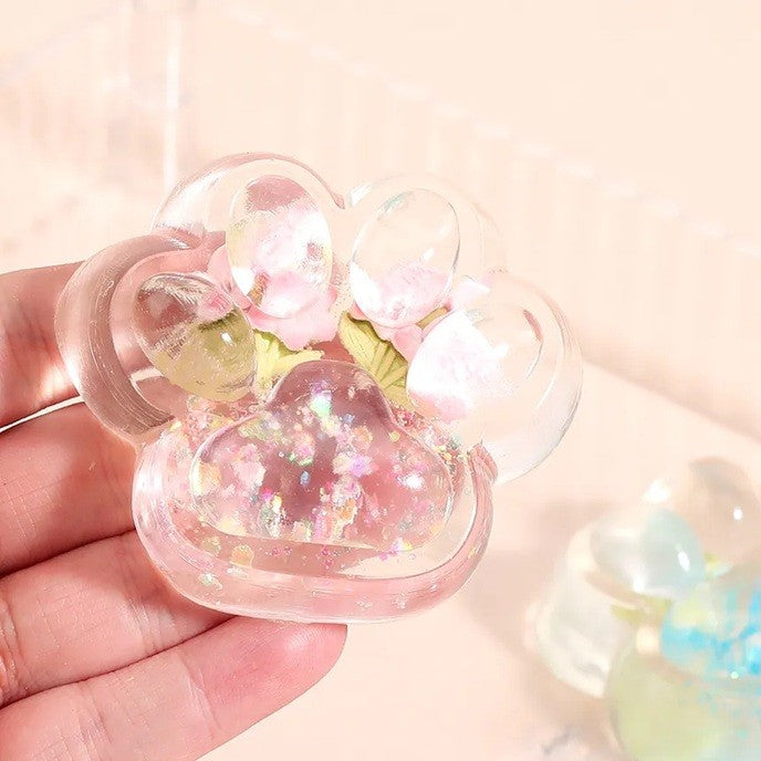 Jucarie Antistres Squishy, Flippy, Labuta de Pisica Pufoasa, cu Revenire Lenta, 7 x 6.5 cm, Model Flori 1, Transparent - vivimall.ro