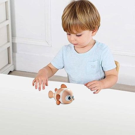 Jucarie mecanica pentru copii Vivimall, pestisor haios, cu cheita, distractiv, se taraste, se misca, 11 x 9 x 7.5 cm cm, portocaliu - vivimall.ro