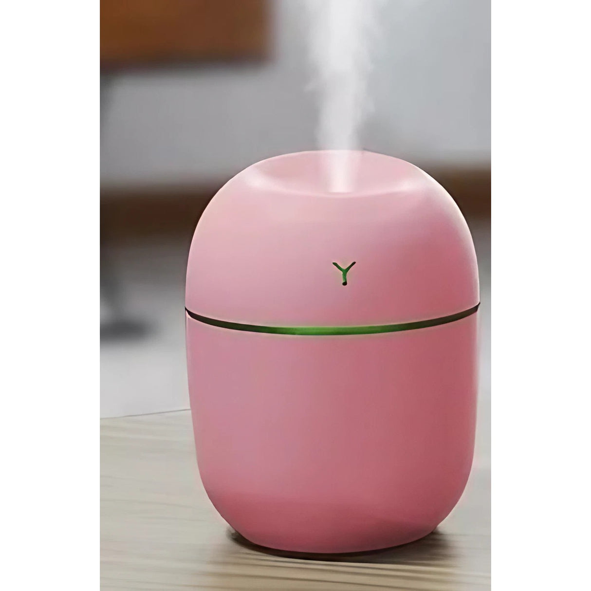 Detaliu buton comandă umidificator roz, 2 moduri vaporizare persistentă și intermitentă