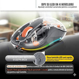 Mouse wireless Flippy gri utilizat pe birou alături de MacBook, mod Multi Device