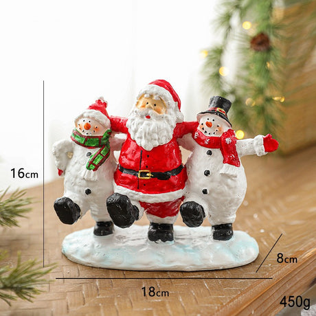 Detaliu pictură figurină Moș Crăciun rășină – expresii vesele și elemente tradiționale festive