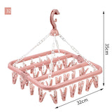 Uscator de rufe Vivimall, 32 de cleme, Plastic, Pliabil, rotire 360 grade, 32x32 cm, Roz - vivimall.ro